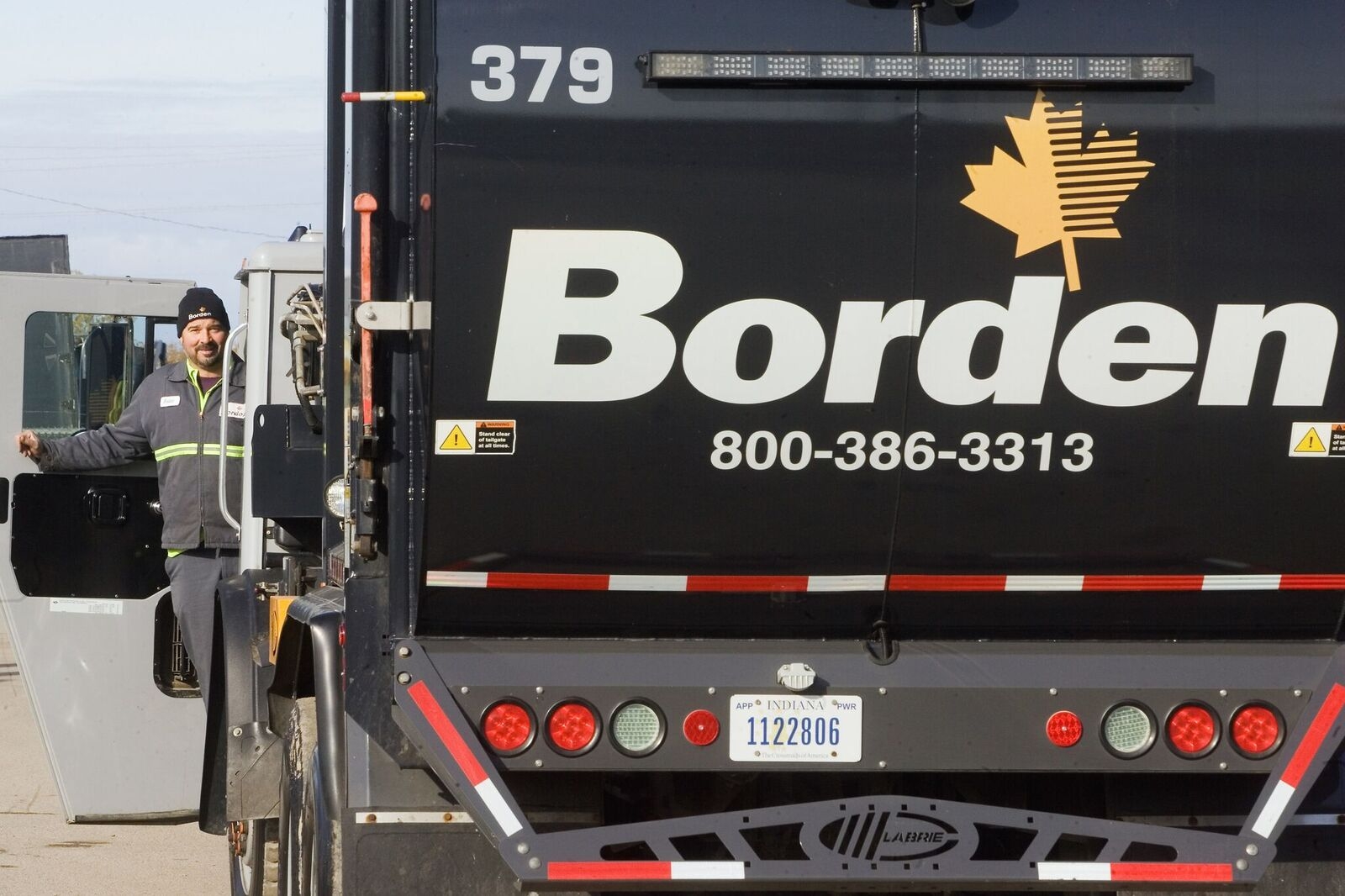 Garbage Truck Driver Smiling
